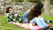 Couple eating junk food in park