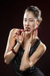 Sexy fashion model eating chocolate