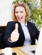 Successful business woman shows thumb up