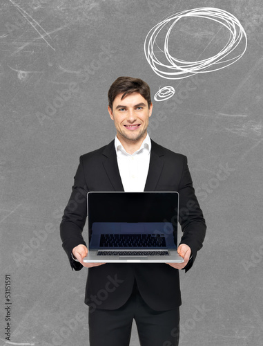 Photo: happy businessman holds the laptop happy businessman holds the laptop