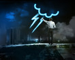 Photo: Businessman draws a glowing signs Businessman draws a glowing signs