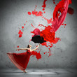 Ballet dancer in flying satin dress with umbrella