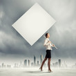 Woman holding blank board