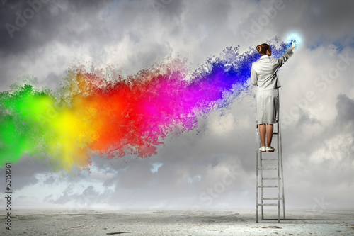 Photo: Young woman drawing splashes Young woman drawing splashes