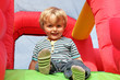 Photo: Child on inflatable bouncy castle Child on inflatable bouncy castle