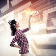 Woman touching virtual screen