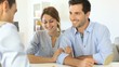 Young couple meeting construction planner