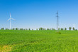Foto: Wind turbine over blue sky on the summer field Wind turbine over blue sky on the summer field