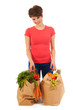 Young adult woman with heavy shopping bags