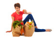 Young adult woman with heavy shopping bags