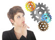 Young woman thinking with gears isolated on white background