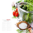 preparing preserves of pickled cucumbers and tomatoes
