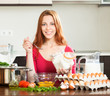 Smiling woman  making dough