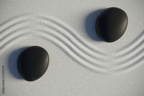 Photo: Zen garden in a top view with stones separated by a wave Zen garden in a top view with stones separated by a wave