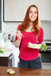 positive   woman eating potatoes