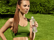 Beautiful Girl drinks Water after Yoga exercise