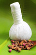 Flower tea rose buds on banana leaves with herbal massage ball