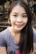 portrait of a young pretty woman smiling outdoors