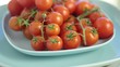 Red tomatoes in a plate rotate