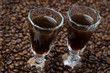two shot glasses of coffee liqueur, horizontal