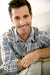 Photo: Portrait of handsome guy relaxing at home Portrait of handsome guy relaxing at home