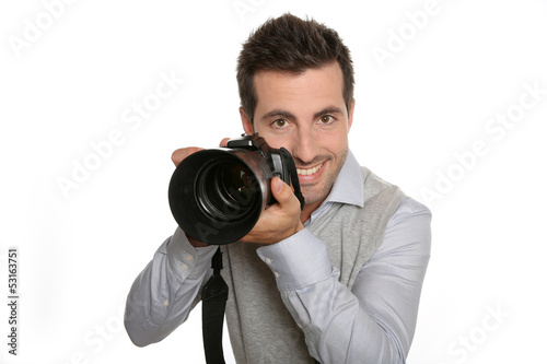 Photo: Portrait of photographer holding digital camera Portrait of photographer holding digital camera