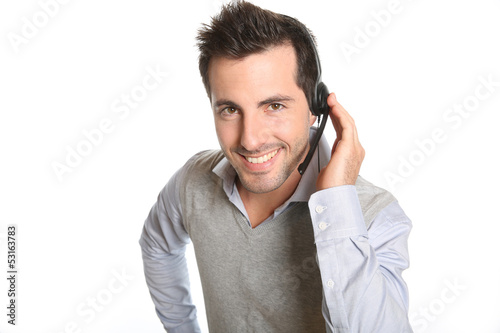 Photo: Customer service representative talking on phone Customer service representative talking on phone