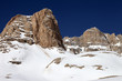 Rocks in snow and clear blue sky