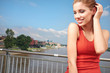 Smiling fitness woman.City river  background