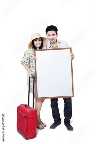 Photo: Asian couple hold blank board on white Asian couple hold blank board on white