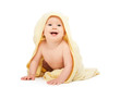 Photo: happy beautiful baby in yellow towel isolated happy beautiful baby in yellow towel isolated