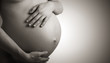 belly of pregnant woman monochrome on dark background belly of pregnant woman monochrome on dark background