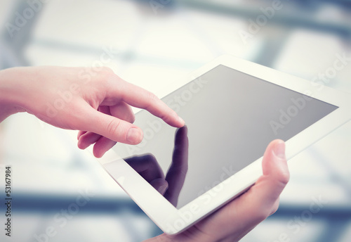 Photo: white tablet with a blank screen in the hands white tablet with a blank screen in the hands