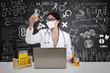 Beautiful scientist with flask and laptop in lab