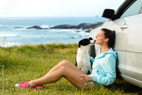 Photo: Happy woman and dog on travel Happy woman and dog on travel