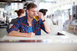 Young man drinking beer in a cafe