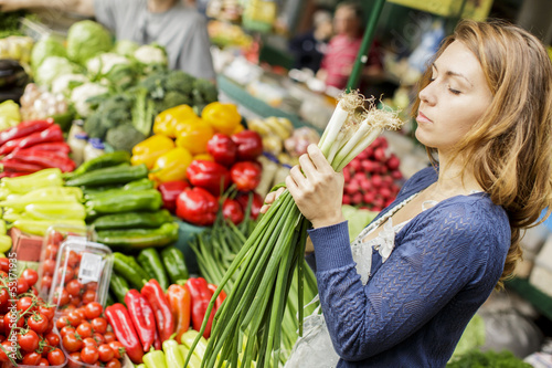 Photo: Young woman at the market Young woman at the market