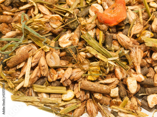 Photo: basic muesli with herbs background for horse . close up basic muesli with herbs background for horse . close up
