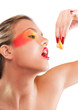 Photo: Woman beauty squeezing a piece of lemon Woman beauty squeezing a piece of lemon
