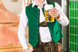 Man with beer glass in brewery
