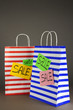 Striped bags on gray background