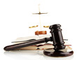 Wooden gavel, golden scales of justice  and books isolated