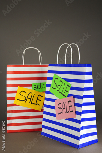 Photo: Striped bags on gray background Striped bags on gray background
