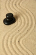 Photo: Zen garden with raked sand and round stones close up Zen garden with raked sand and round stones close up