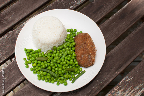 Photo: Cutlet dinner with rice and green peas Cutlet dinner with rice and green peas