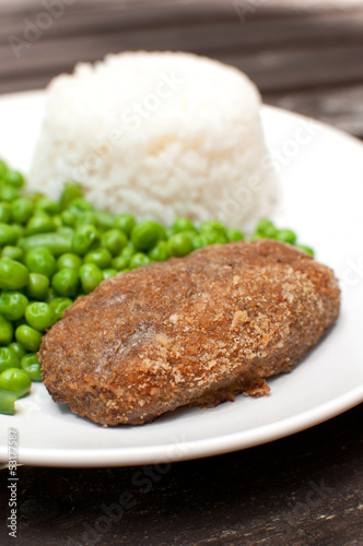 Photo: Breaded cutlet with rice and green salad Breaded cutlet with rice and green salad