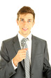 Young businessman talking with microphone, isolated on white