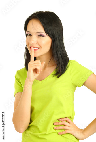 Photo: Girl shows sign of silence isolated on white Girl shows sign of silence isolated on white