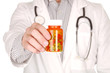 Doctor With Medication in Prescription Bottles