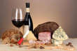 Photo: Exquisite still life of wine, cheese and meat products Exquisite still life of wine, cheese and meat products